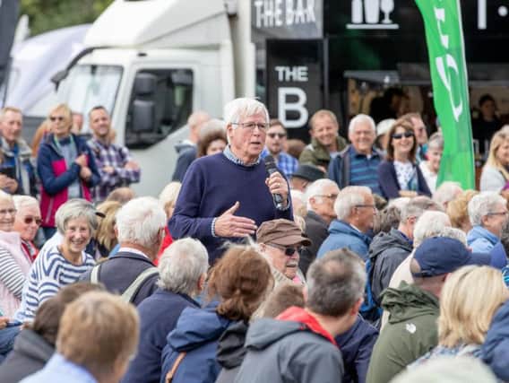 John Craven, a former reporter for The Yorkshire Post and a long-serving presenter for BBC's Countryfile, speaking to the public on the opening day of Countryside Live at Castle Howard. Picture by Charlotte Graham.