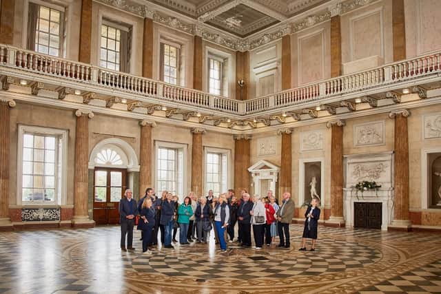 Sue Gravil and a tour group in the Marble Saloon