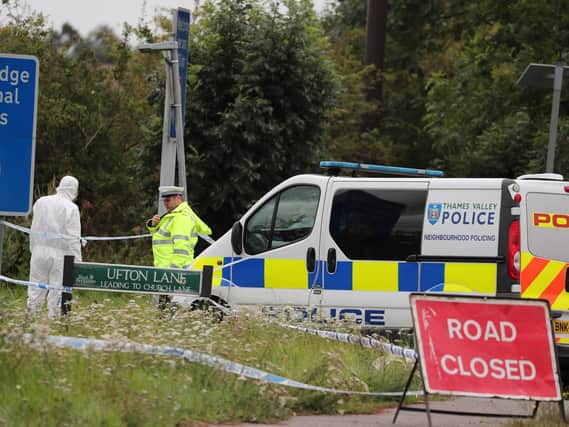 Police officers at the scene on Ufton Lane, near Sulhamstead, Berkshire, where a Thames Valley Police officer was killed whilst attending a reported burglary on Thursday evening. PRESS ASSOCIATION.