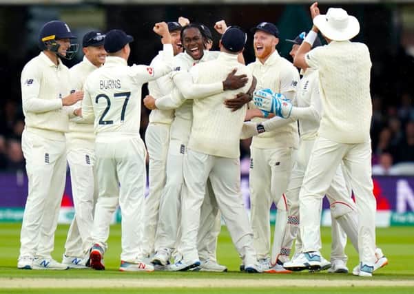 England's Jofra Archer (centre) celebrates taking the wicket of Australia's Cameron Bancroft.