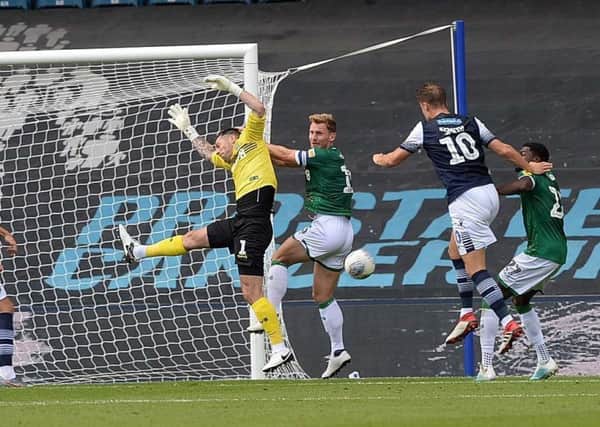 Owls keeper Keiren Westwood misses a cross only for Millwall's Matt Smith to head in the winner. Picture: Steve Ellis