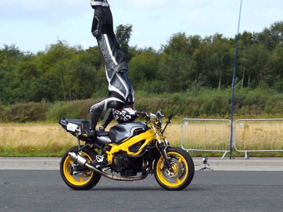 Marco George also broke the world record for the fastest headstand on a motorbike, hitting 76mph at the event on Saturday.