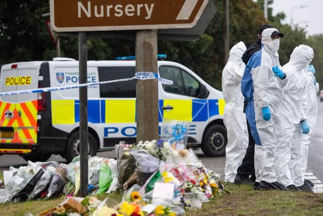 Floral tributes have been left at the scene following the murder of PC Andrew Harper.