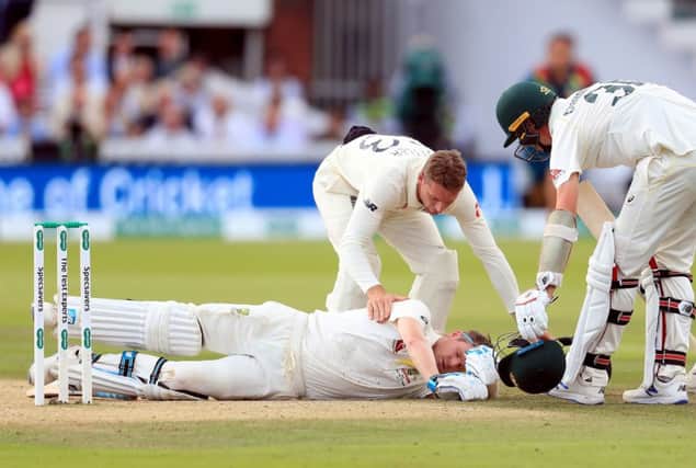 Englands Jos Buttler shows concern for Australias Steve Smith after the batsman slumped to the ground having been hit on the head by a delivery from Jofra Archer (Picture: Mike Egerton/PA Wire).