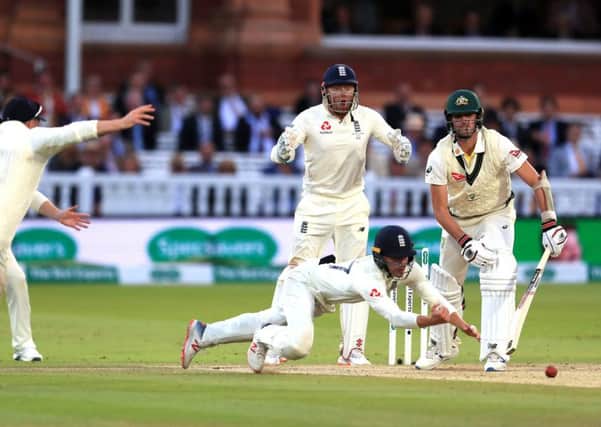Englands Rory Burns just fails to take a catch offered by Australias Pat Cummins in the tourists second innings at Lords (Picture: Mike Egerton/PA Wire).
