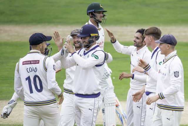 Yorkshire's Keshav Maharaj celebrates the wicket of Nottinghamshire's Joe Clarke.