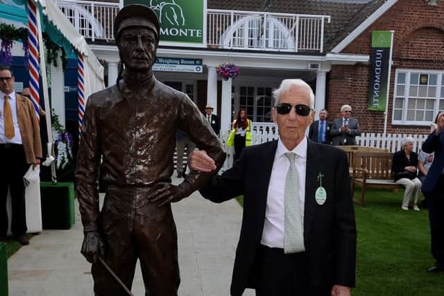 Lester Piggott with the Willie Newton-designed statue - one of nine erected around the country.