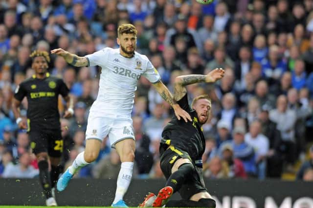 HELLO AGAIN: Brentford's Pontus Jansson makes last-ditch clearence to thwart former Leeds United team-mate Mateusz Klich. Picture: Tony Johnson.
