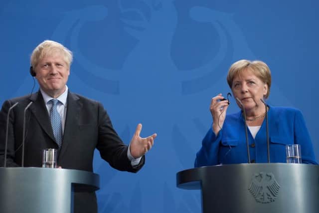 Boris Johnson with Germany's leader Angela Merkel.