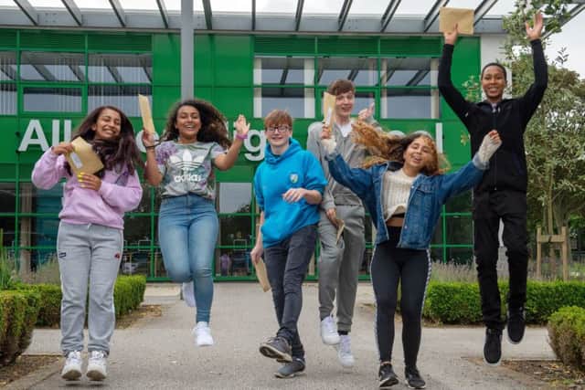 Pupils celebrate after receiving their results.
