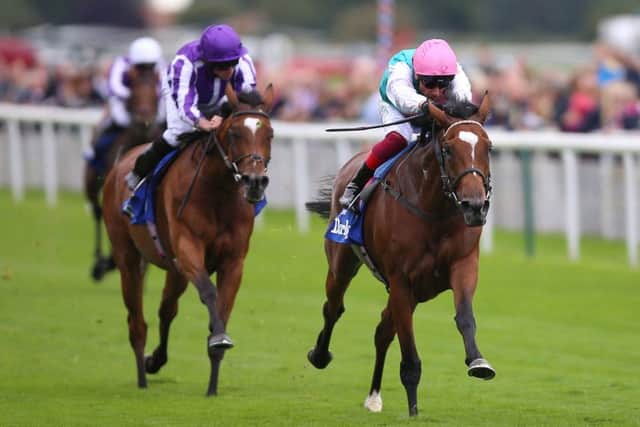 Enable and Frankie Dettori (right) surge clear of Magical in the Yorkshire Oaks.