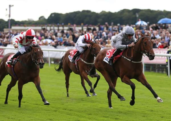 LEADING LIGHT: Living In The Past and Daniel Tudhope (right)  win The Sky Bet Lowther Stakes at York. Picture: Nigel French/PA