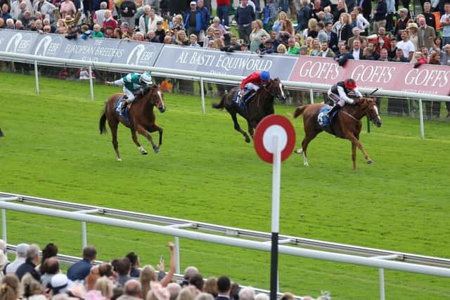 OUT IN FRONT: Search For A Song and Oisin Murphy, right, wins The British EBF & Sir Henry Cecil Galtres Stakes at York. Picture: Nigel French/PA