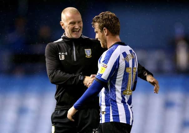 Well done: Sheffield Wednesday caretaker manager Lee Bullen  speaks to Sam Winnall at the end of the Championship match at Hillsborough.