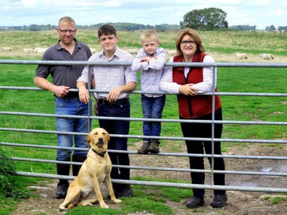 Left to right: Andrew Percy, Aaron Bell, Luke Percy and Nicola Bell with dog Willow at Springhill farm near Jervaulx. Picture by Gary Longbottom.