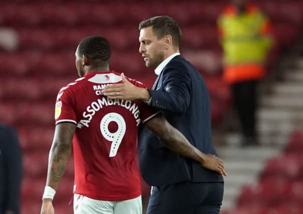 Middlesbrough's Britt Assombalonga and manager Jonathan Woodgate. Picture: Owen Humphreys/PA