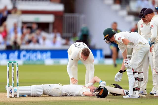HORRIFIC: Australia's Steve Smith ends up on the floor after being hit by a delivery from Jofra Archer on day four of the Ashes Test at Lord's. Picture: Mike Egerton/PA