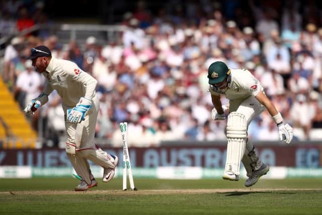England's Jonny Bairstow, left, cheers, as Australia's Marnus Labuschagne is run out on day three at Headingley. Picture: Tim Goode/PA