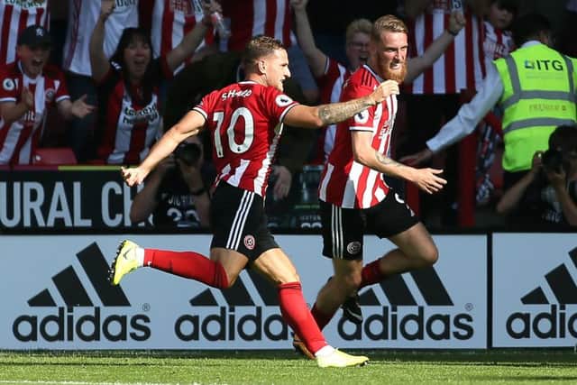 Sheffield United's Oliver McBurnie (right) celebrates scoring his side's goal against Leicester City at Bramall Lane. Picture: Richard Sellers/PA