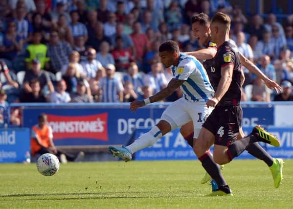 Going close: Karlan Grant lets fly with a rare shot against Reading. Picture: Graham Crowther