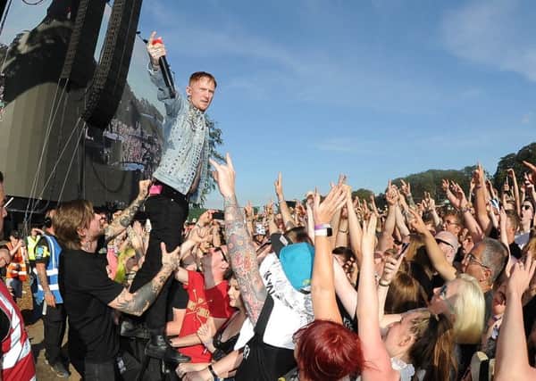 Leeds Festival Day1..Frank Carter and the rattlesnakes  jumps in the crowd..23rd August 2019.Picture by Simon Hulme
