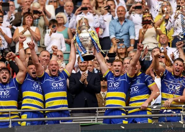 Warrington celebrate winning the Coral Challenge Cup Final at Wembley.