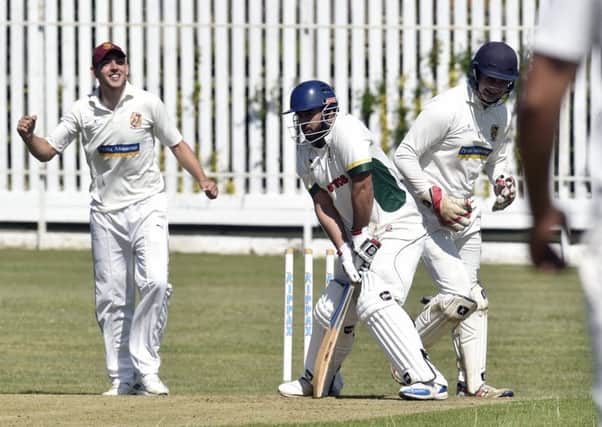 Wrenthorpe wicket keeper Sam Storr looks on as the bails fly as Irfan Amjad is bowled by Sudara Udfagedara for eight runs. Methley won by eight wickets and are now out of the relegration zone. Picture: Steve Riding
