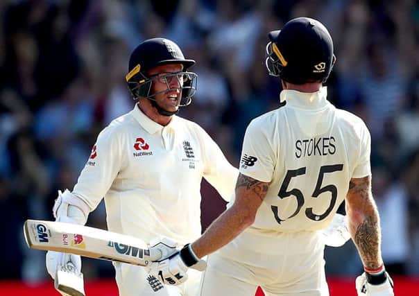 England's Ben Stokes celebrates victory with Jack Leach (left).