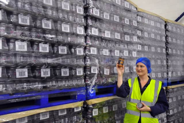 Annie Shaw in the warehouse with some  chutney's  ready for dispatch made by Shaws of Huddersfield