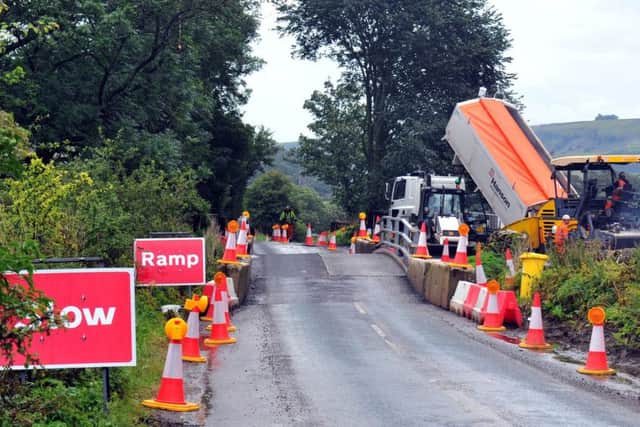 Work takes place to put in a temporary bridge on the Reeth to Richmond road.