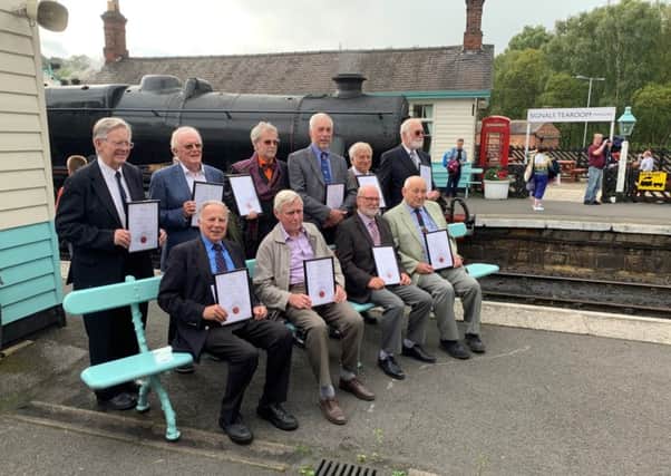 Ten volunteers celebrate 50 years of service with the North Yorkshire Moors Railway.