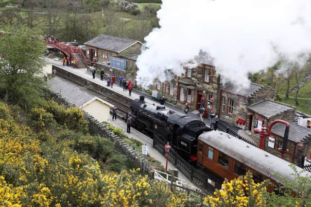A steam train pulls into Goathland Station - volunteers are integral to the North Yorkshire Moors Railway.