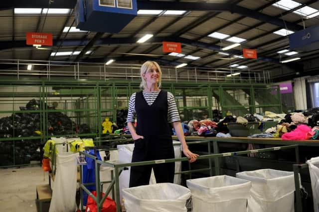 Online shop manager Holly Bentley in the loading bay at the Oxfam Wastesaver operation in Batley. Picture by Simon Hulme