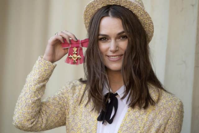 Keira Knightley, star of upcoming Official Secrets, with her OBE medal. Credit: Victoria Jones/PA.
