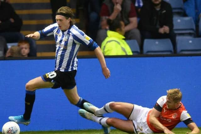 Sheffield Wednesday winger Adam Reach is pictured taking on Luton Towns James Bree in the Owls 1-0 earlier this month. (Picture: Steve Ellis)