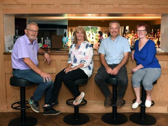 The White Horse pub in Church Fenton has been reopened by the community, who have raised the money to buy it. Pictured are Church Fenton Community Hub members from left, Mike Wright, Lesley Wright, Nigel Thirkill and Sue Babington. Picture by Jonathan Gawthorpe.
