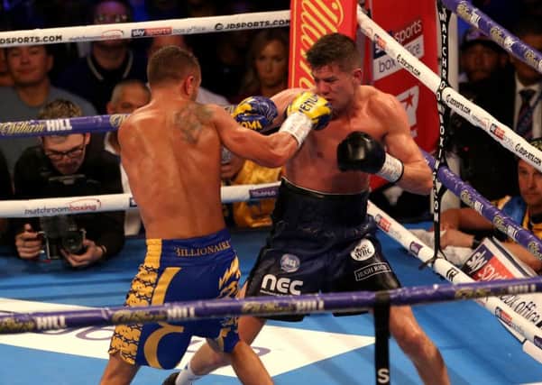 Into battle: Vasiliy Lomachenko, right, and Luke Campbell in action during the WBC, WBO, WBA & Ring Magazine World lightweight championship contest. Picture: Steven Paston/PA
