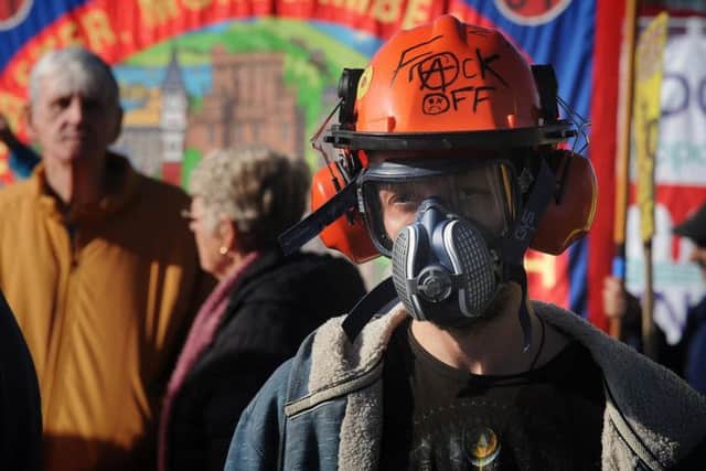 An anti-fracking demonstrator taking part in a march against the Lancashire site last October.