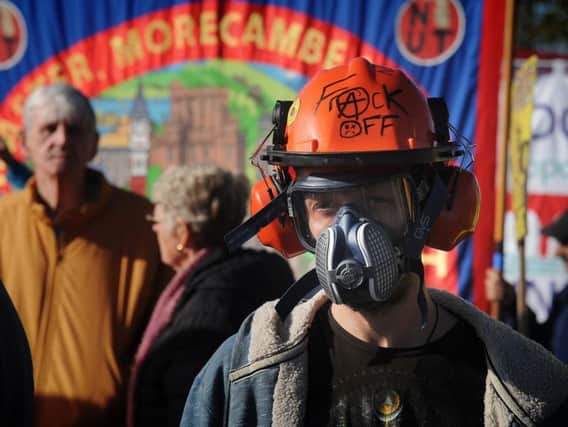 An anti-fracking demonstrator taking part in a march against the Lancashire site last October.