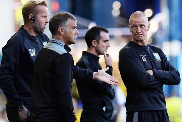 A worried looking Owls caretaker manager Lee Bullen with Neil Thompson and Nicky Weaver (Picture: Steve Ellis)