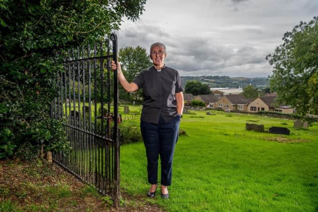 Canon Maggie McLean, pictured in the grounds of the Church of Christ the King Battyeford in Mirfield, was one of the first women to be ordained in the Church of England. Picture by James Hardisty.