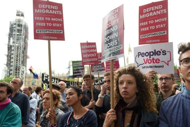 Anti-Brexit protesters gather in Parliament Square.