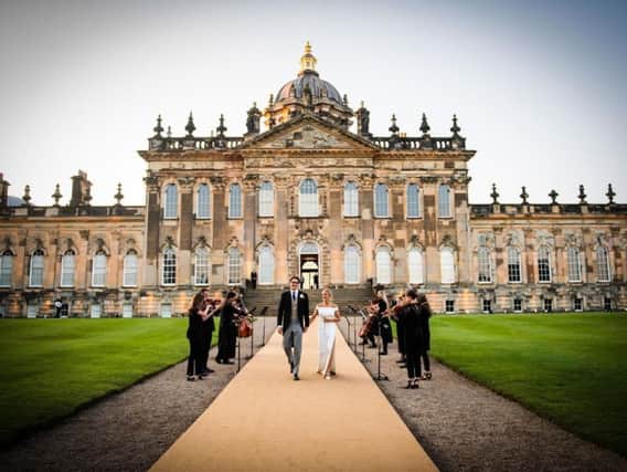 Ellie, Caspar and their orchestra outside Castle Howard