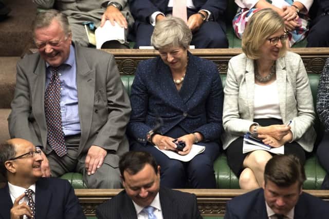 Tory grabdee Ken Clare, pictured next to Theresa May, has lost the Tory whip after voting against the Government.