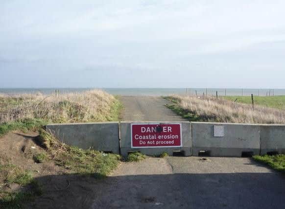 A sign warning of coastal erosion in Hornsea, which has lost at least one village to the sea since the Roman period in Britain.