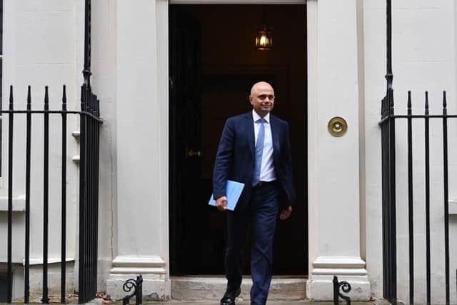 Sajid Javid leaves 11 Downing Street before delivering his spending statement.