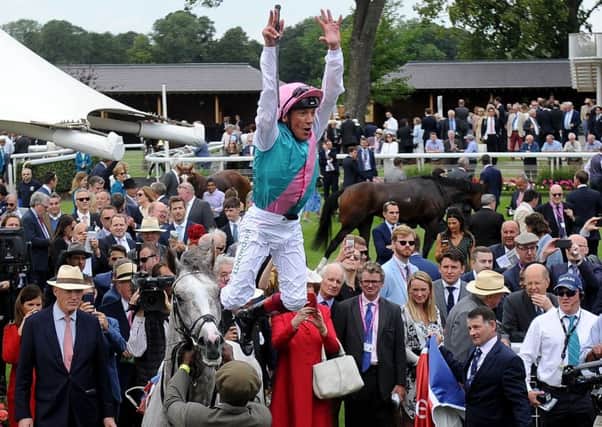 Frankie Dettori performed a trademark flying dismount when St Leger favourite Logician won the Great Voltigeur Stakes at York.