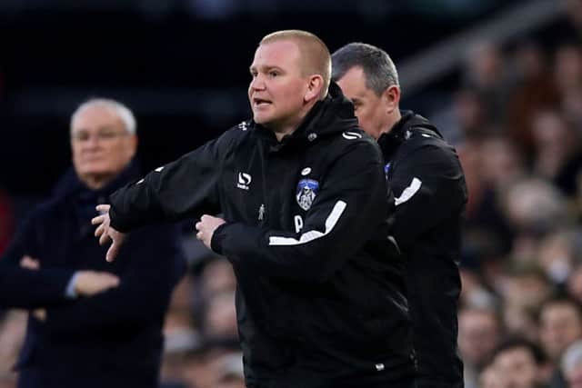 SHOCK WIN: Pete Wild gestures on the touchline during Oldham's surprise FA Cup win against Fulham at Craven Cottage. Picture: John Walton/PA