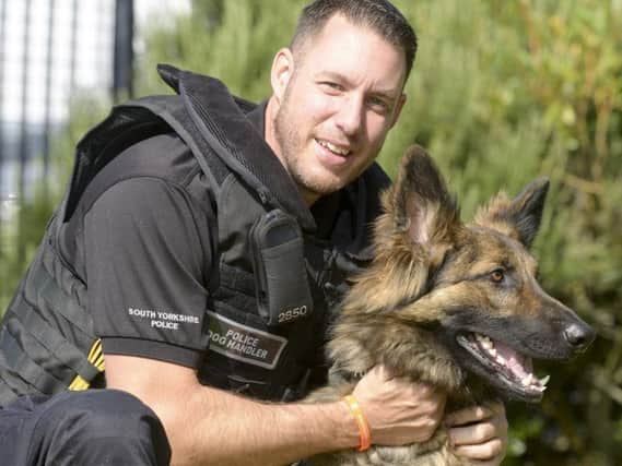Pc Matt Aris with police dog Bear.