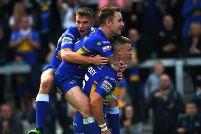 Leeds Rhinos Ash Handley is congratulated on one of his 22 tries with Richie Myler and Jack Walker.
 (Picture: Jonathan Gawthorpe)